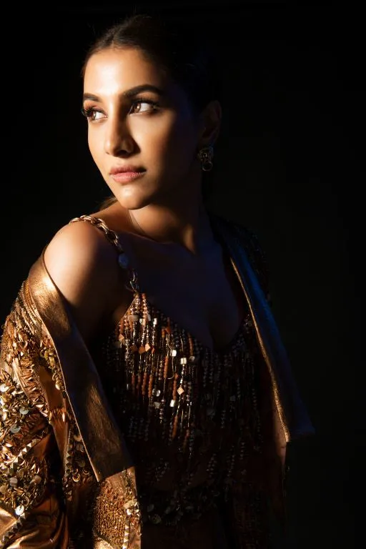 Rukmini Maitra in Nirmooha's Hand Embriodered Bronze Metallic Bralet, Bronze Metallic Short Jacket and Bronze Baggy Pants